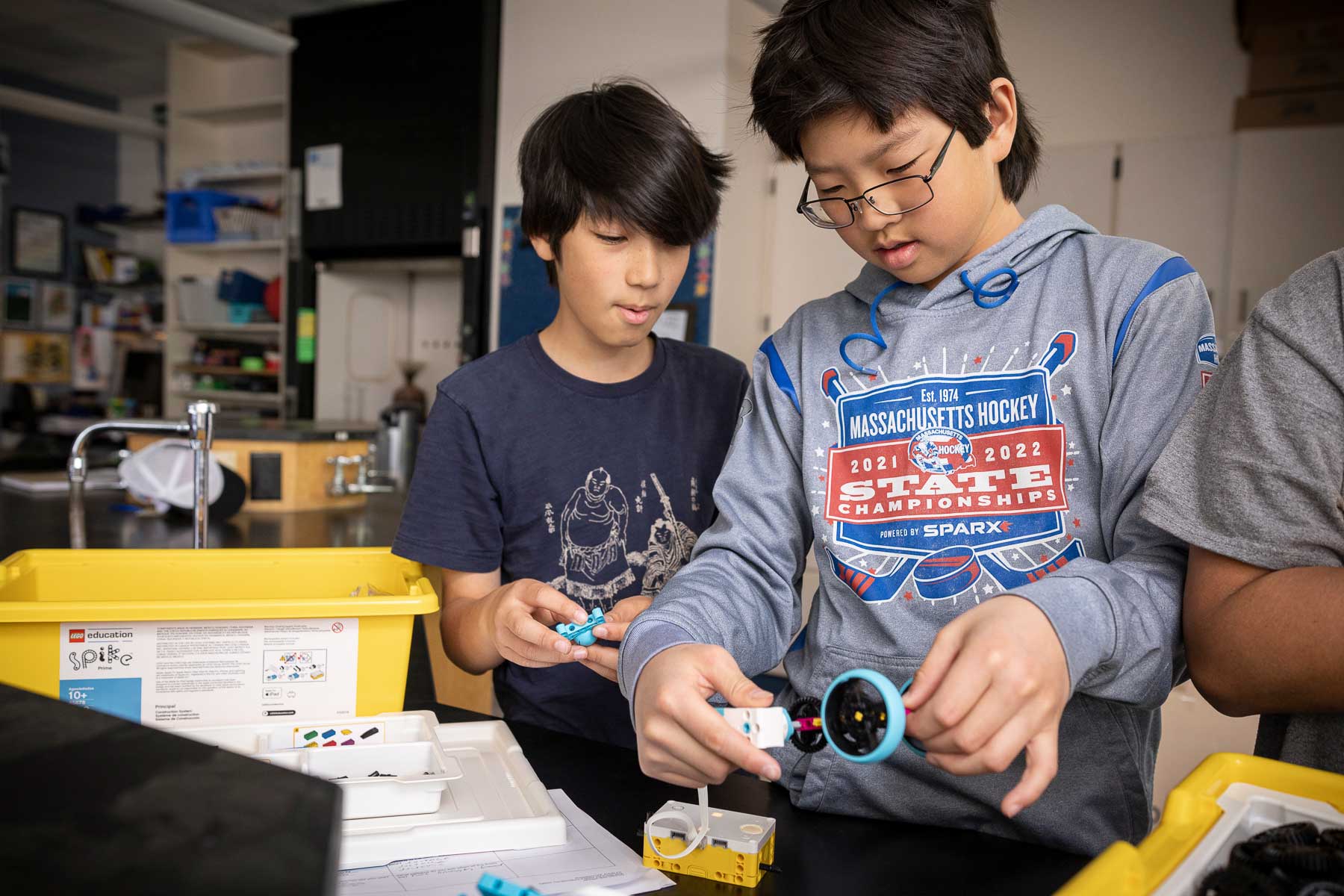 Two students work with a robotics kit