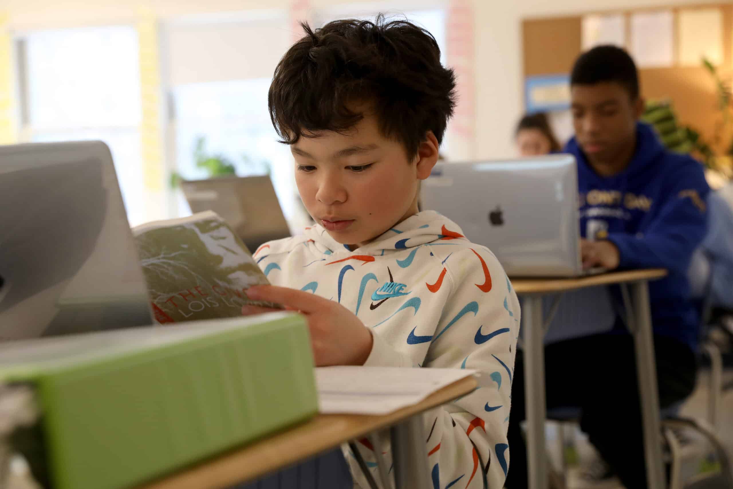 A student reading at their desk